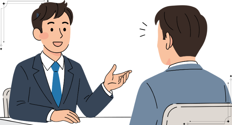 面接でビジネススーツの男性が応募者に質問している様子｜就職活動の面接シーンイメージ